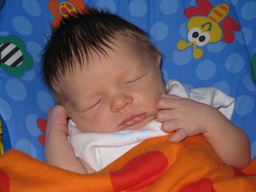 Henry sleeping in bouncy chair