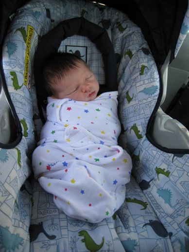 Henry sleeping in car seat