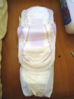 Poise pad inserted into diaper